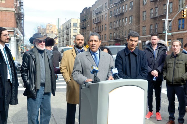 Sen. Adriano Espaillat (center) held a press conference on the hate crime investigation.